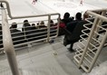 Image of a group of people sitting on a bench