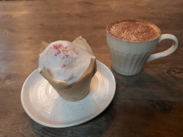 Picture of coffee and a cupcake
