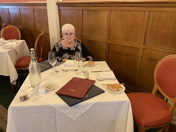 Image of a person sat at a table