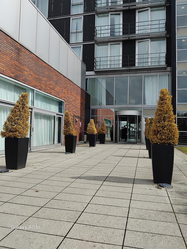 This is the main entrance to the hotel from the car park area the power assisted door is to the right of the revolving door in the picture