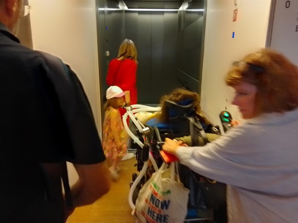 Image of people going into a lift