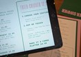 image of menu on paper and on tablet