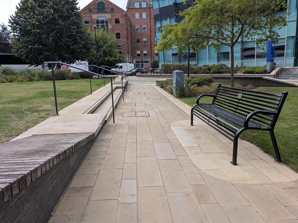 image of benches and steps up to grass