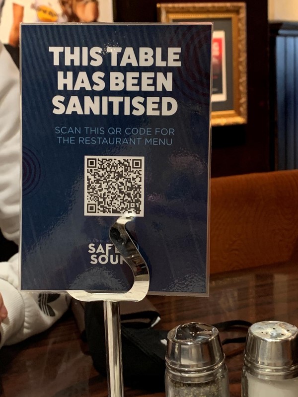 Sign on table that has the QR code menu