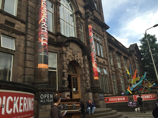 Front of Summerhall. Wheelchair access sign on the right.