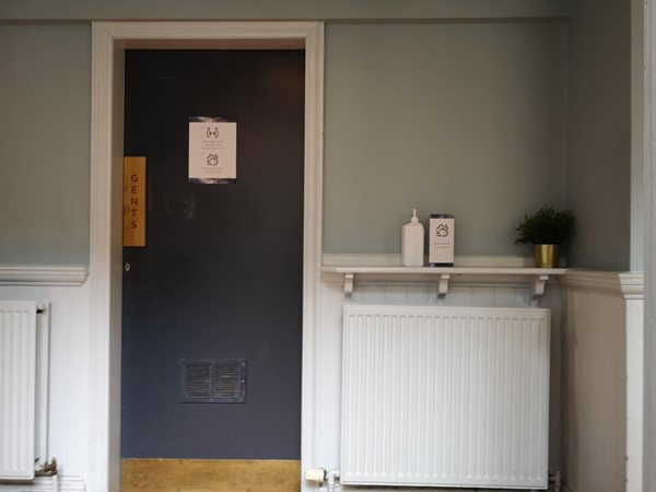 Gents toilets with hand sanitiser.