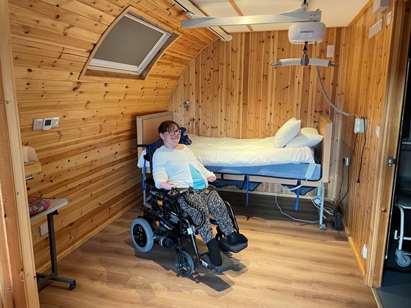 Main bedroom with electric profiling bed and ceiling hoist