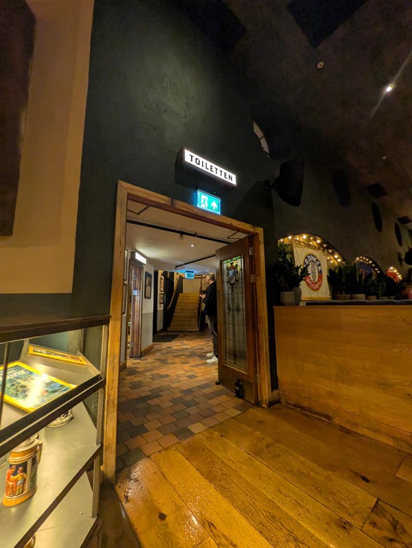Image of doorway to toilet corridor