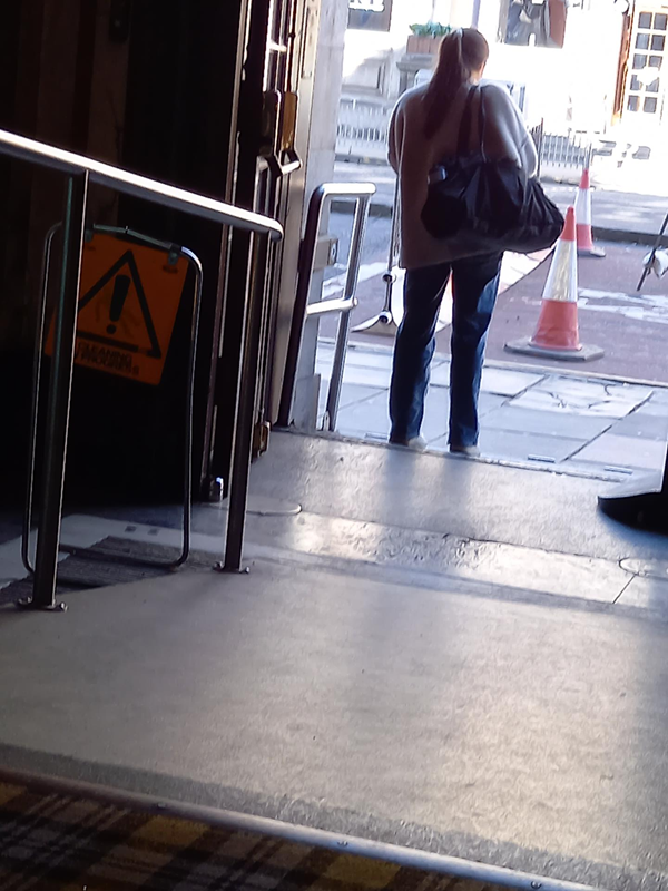 The lady's standing on the metal ramp which crosses the threshold at the George St entrance. It's pretty gentle. The other ramp (foreground) isn't nearly as scary as I feared - the metal frame of the yellow sign is about three feet high, so hopefully that gives a sense of scale and steepness. So if you're worried about the gradient like I was - please don't be!