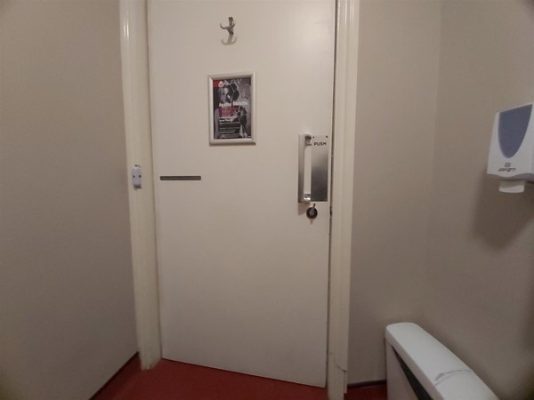 Image of an accessible toilet door