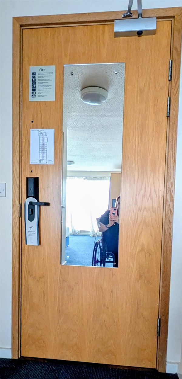 Image of the hotel room door from the inside