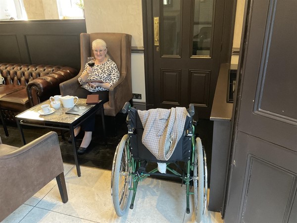 Image of a person sitting at a table.