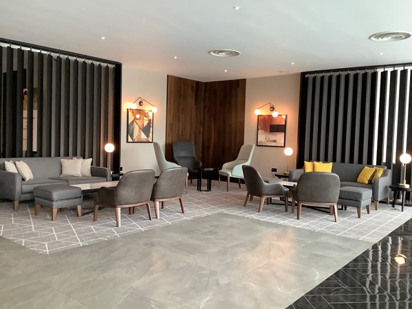 Hotel reception area with seating and tables