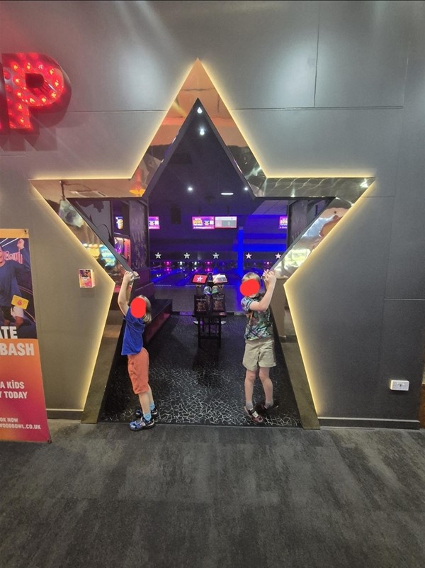 Image of two children in a star shaped door