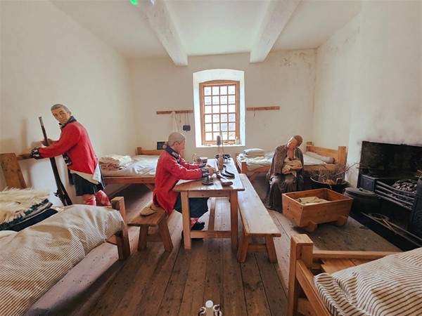 Inside the barracks, showing you the soldier and their families living together in the one room