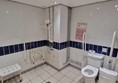 Large accessible toilet, throught the doors to pool on ground floor.