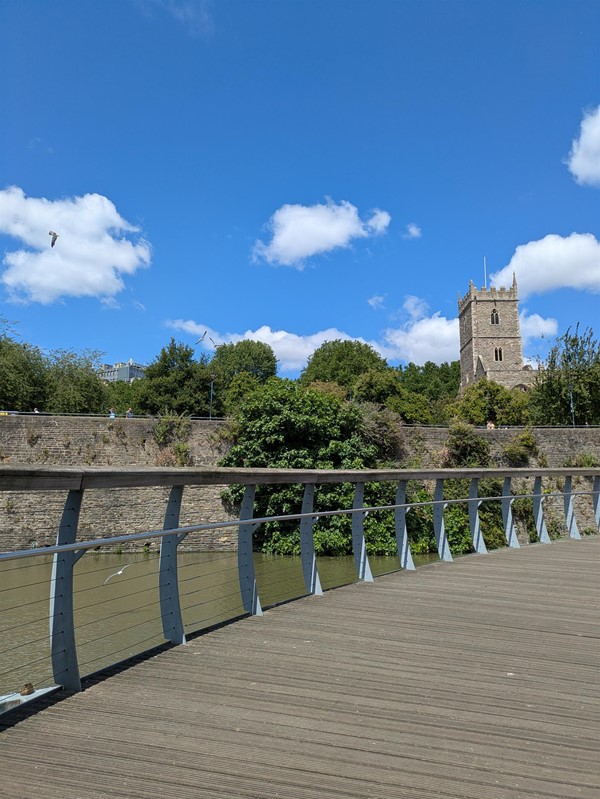 Image of the  ruins of  St. Peter's Church  from a wooden bridge
