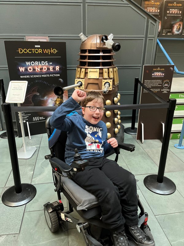 Person in front of a dalek