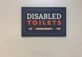Photo of accessible toilet sign.