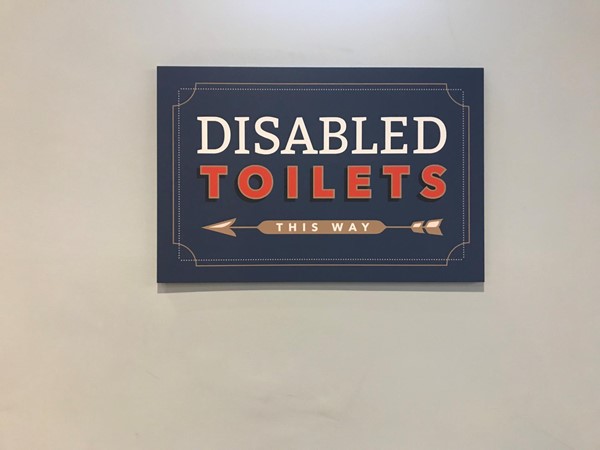 Photo of accessible toilet sign.