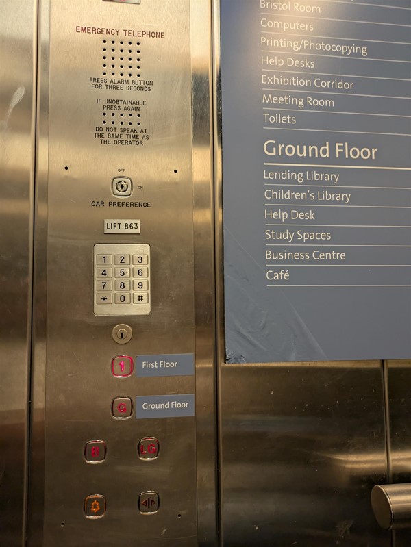 Image of lift buttons inside the lift. The lift buttons do not have Braille Markings