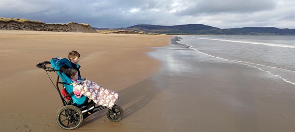 Image of two children on a beach