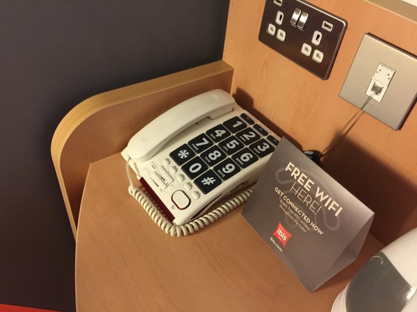 A large button telephone in the accessible bedroom
