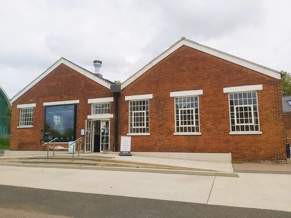 Picture of a building with "Hendon Kitchen" sign