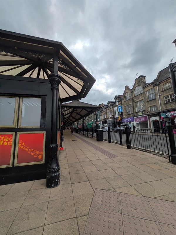 Image of the bus station shot and some tactile paving on the pavement