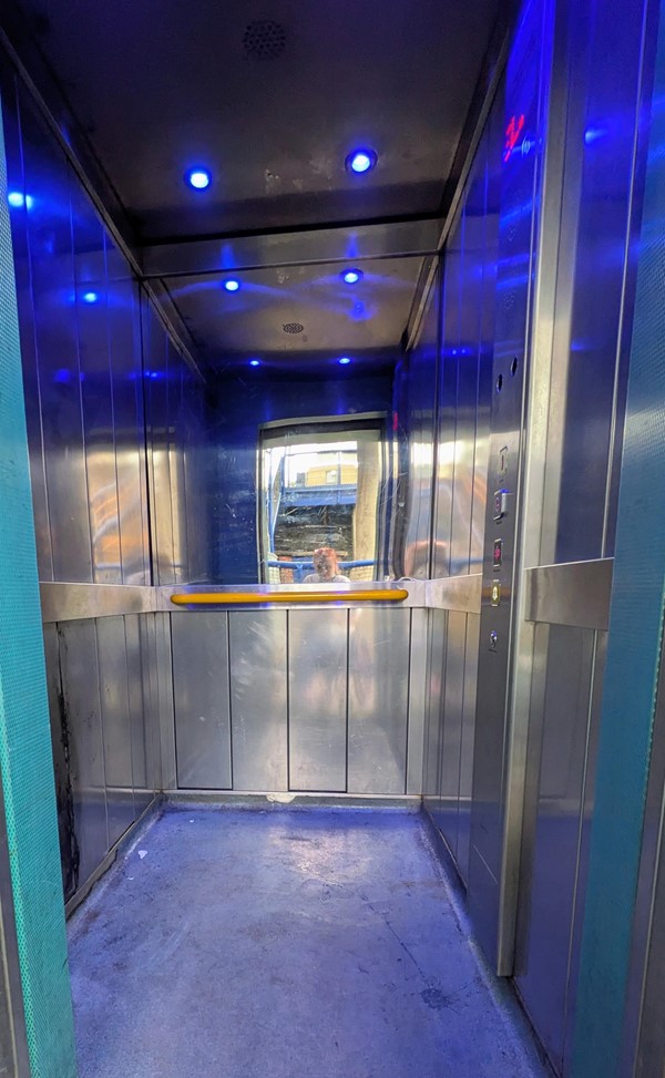Image of inside lift with blue lighting