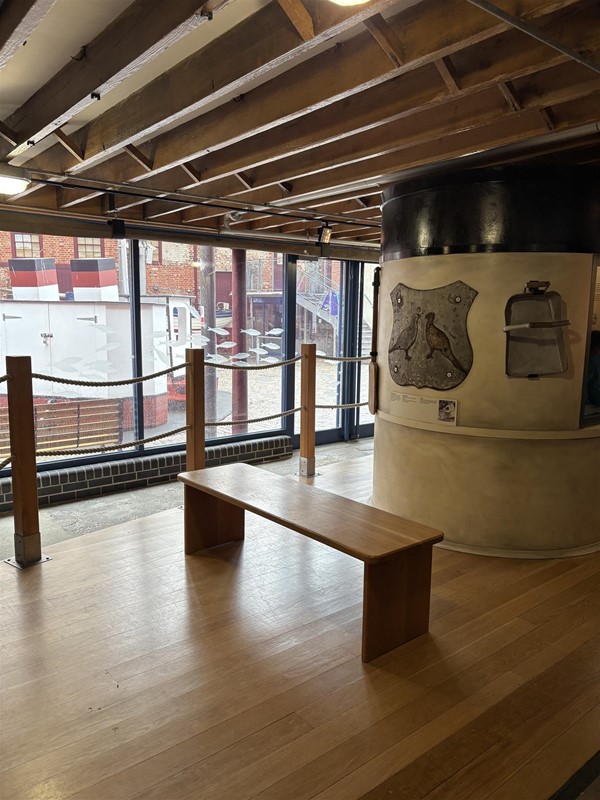 Image of a bench in front of a display