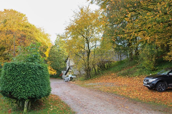 Road down from the pitches to the facilitites block which is where the buildings are on the right at the bottom of the hill. The hill is steeper than it looks in the picture.