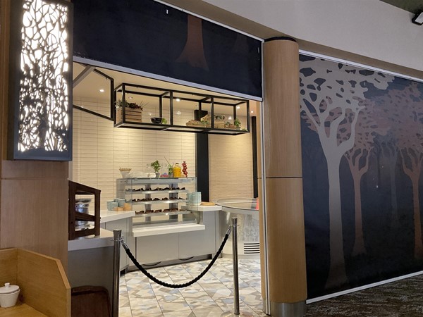 Image of a stand with cakes on