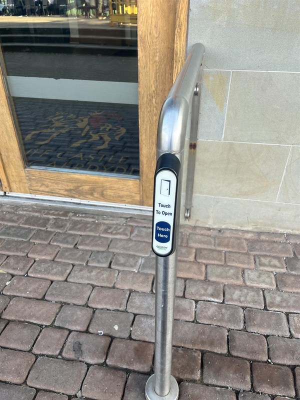 Image of a button to open a door.