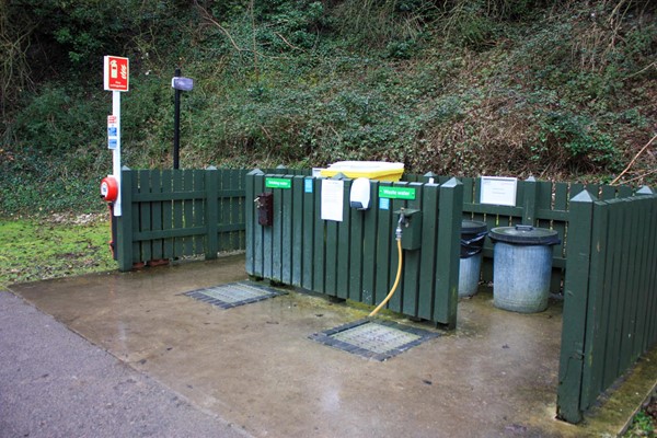 General service point with easy access drinking water and bins.
