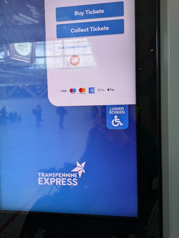 Image of the ticket machine - A large touch screen with an option to lower the screen.