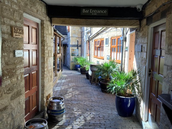t still has its historical courtyard of a cobbled archway, beautifully kept today.