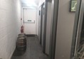 Image of the corridor leading to the individual toilets.