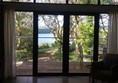 Living area looking out over balcony towards river