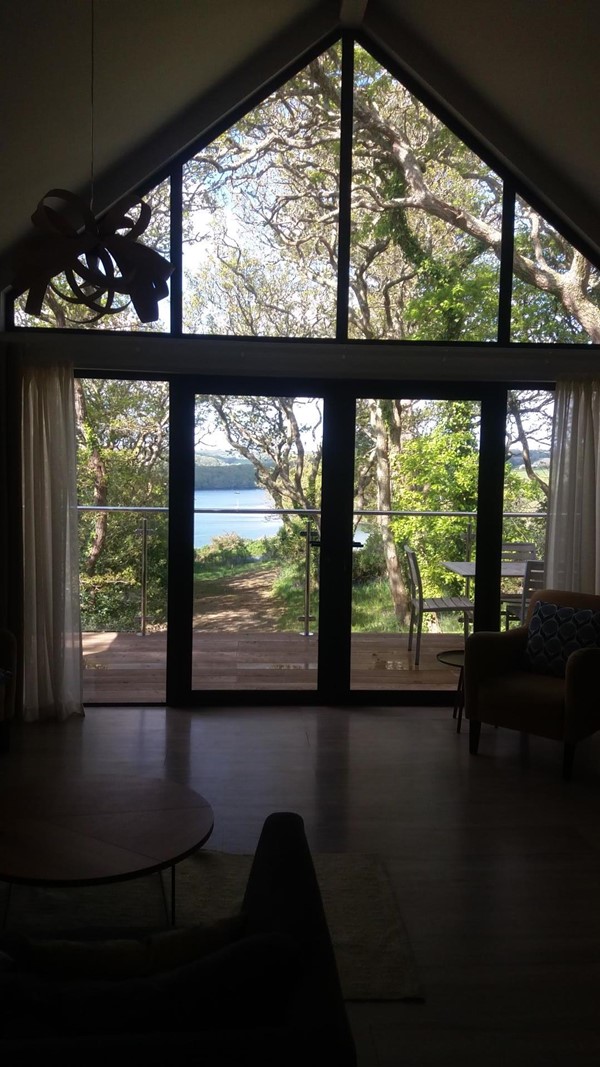 Living area looking out over balcony towards river