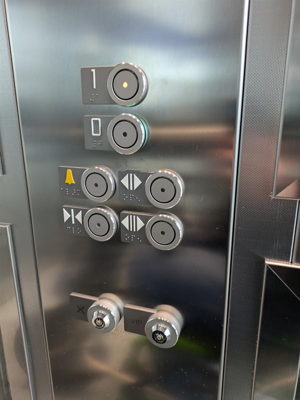 Image of lift button The lift buttons have braille markings