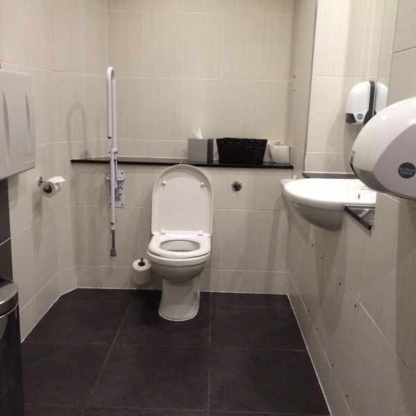 The accessible toilet by the bar and dining room.