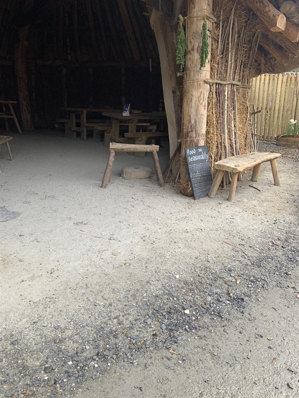 Image of a food sign outside a wooden building