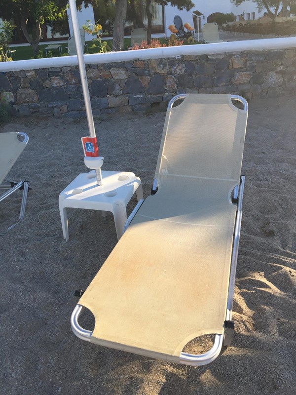 Sun lounger reserved for blue badge users on the beach- thoughtful touch