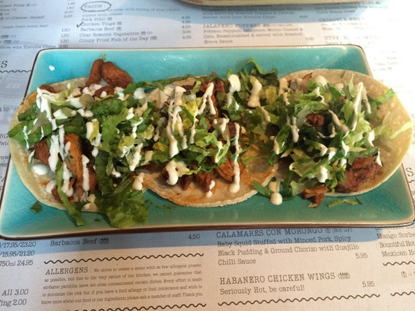 Photo of chicken tinga tacos.