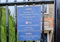 Image of the signage about the opening hours of the garden