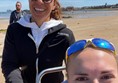 Two people smiling at the camera on North Berwick beach