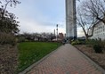 Image of walkway with a tower block in the background