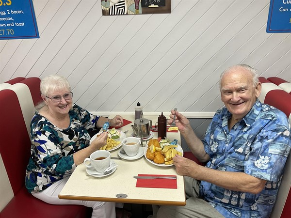 Image of two people at a table
