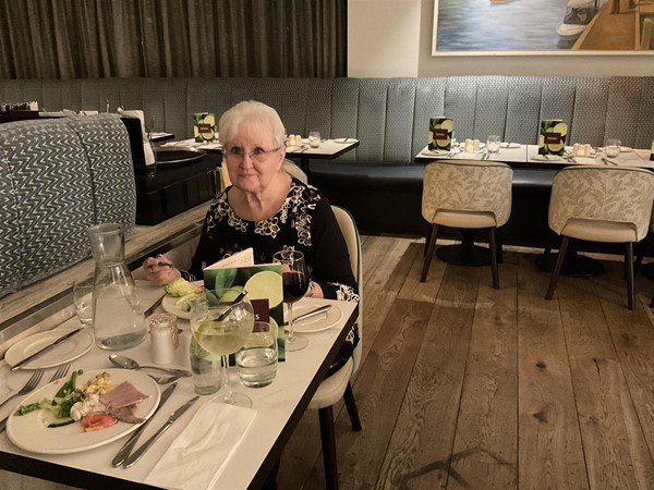 Imagee of a person sitting at a table